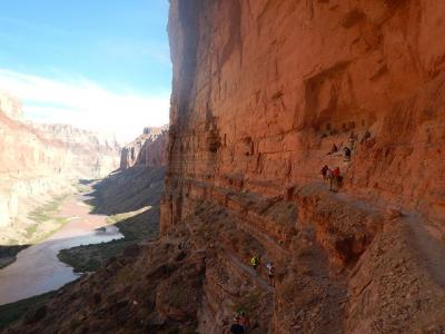 Hikers on the way to visit an Ancestral Puebloan granary at Nankoweap.