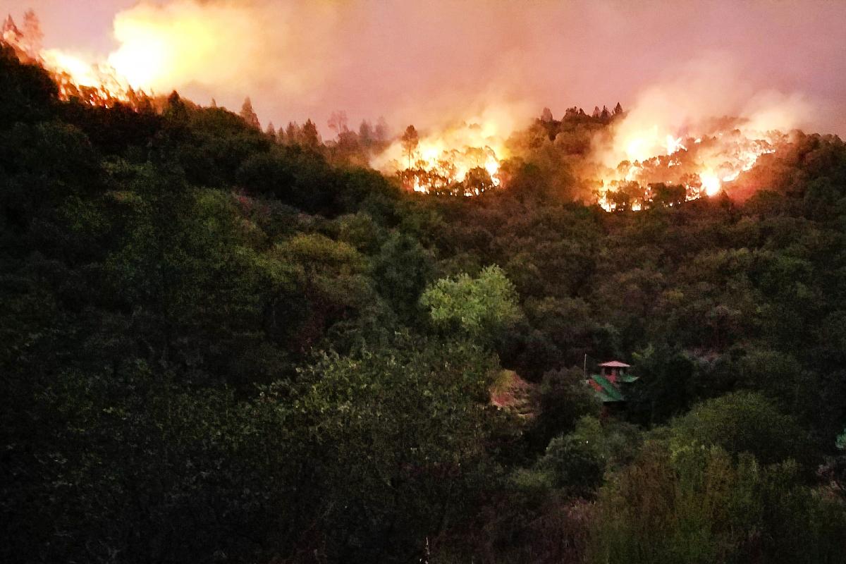 A fire burns out of control along a ridge during the California wildfires in Rough and Ready, Calif., Oct. 12, 2017. California National Guard photo