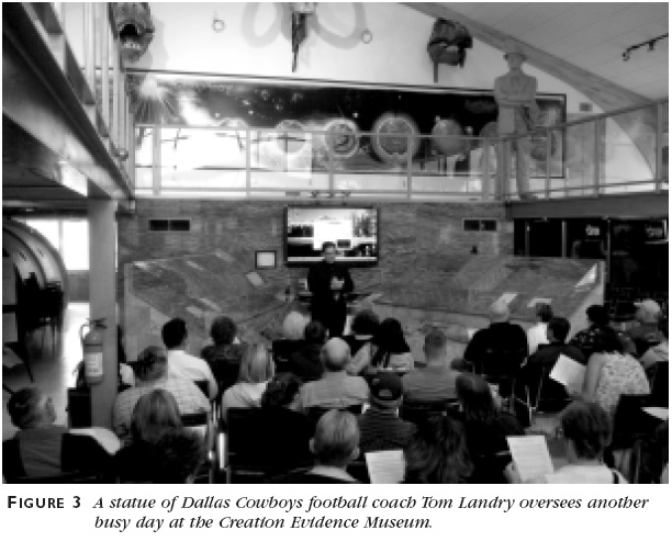 Figure 3: A statue of Dallas Cowboys football coach Tom Landry oversees another busy day at the Creation Evidence Museum.