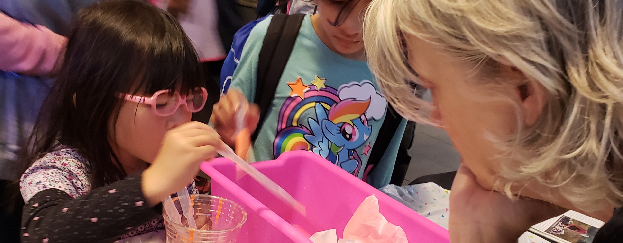 Elementary-age girls doing a science experiment