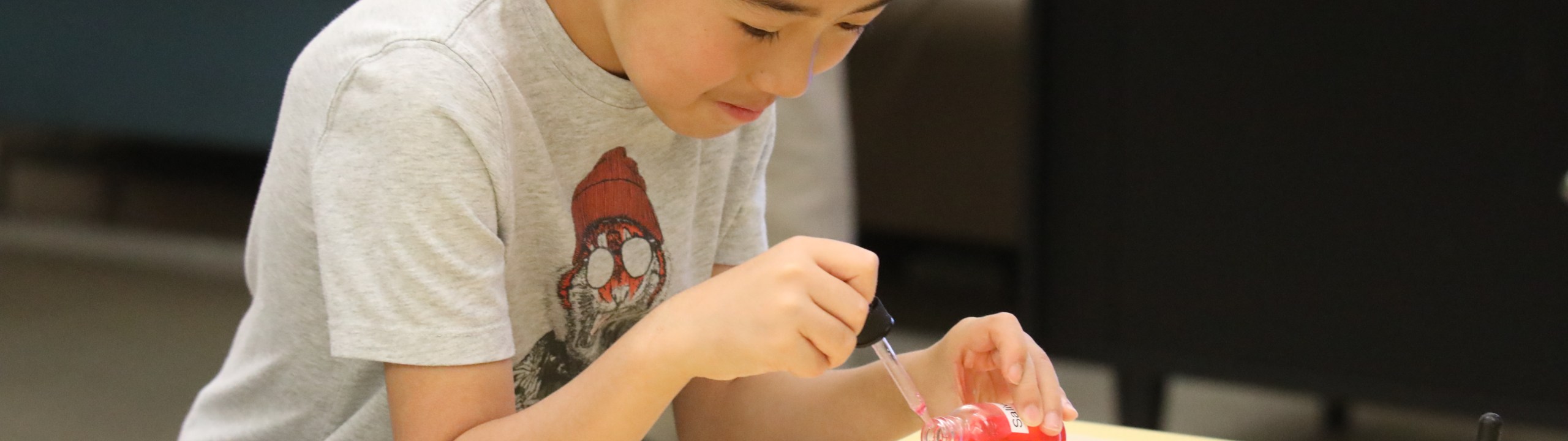 A boy doing an experiment