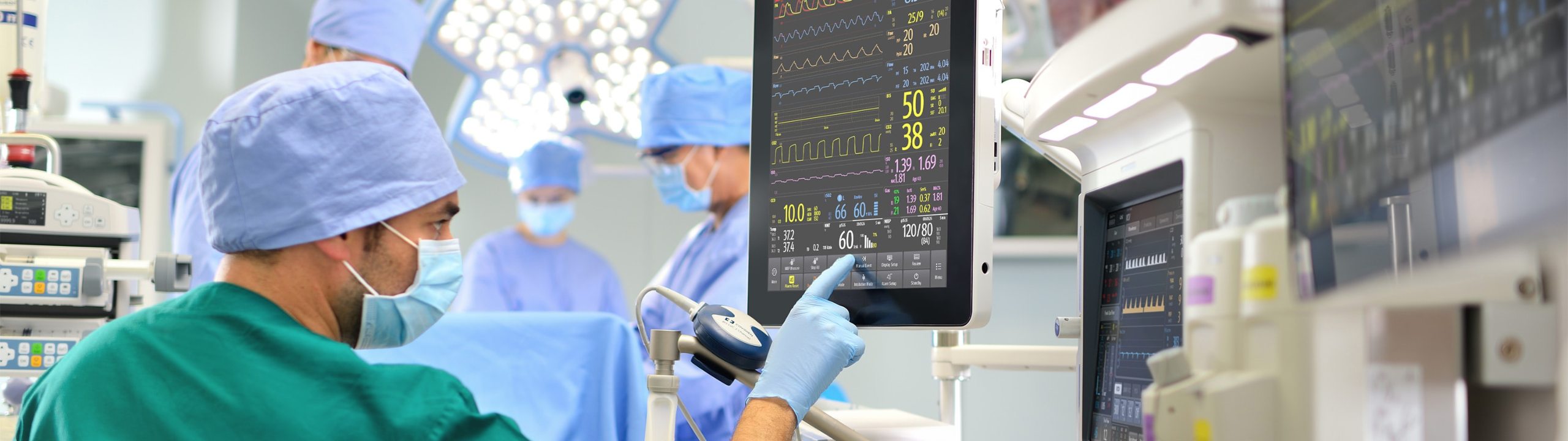 Medical worker checking a display.