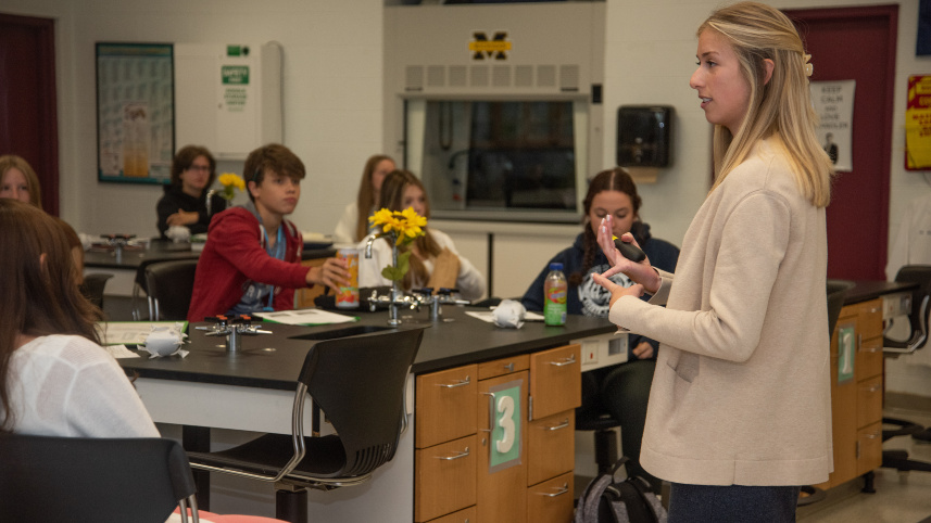 Chandler Missig teaching in front of her class.