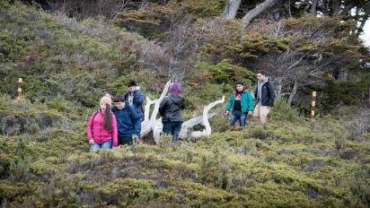 Students walking along a hillside.